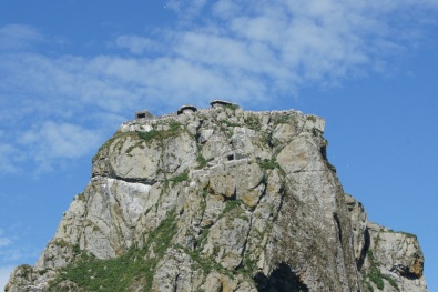 The buildings on the top of this rock are bunkers from WWII